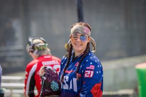 Girl having fun playing paintball