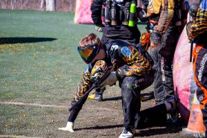 Person sets up to fire his paintball gun